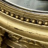 Miroir ancien ovale doré – style Louis XVI avec nœud ruban