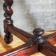Antique stool in turned and carved solid wood