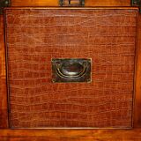 Pair of open bookshelves in crocodile leather with drawers and compartments.