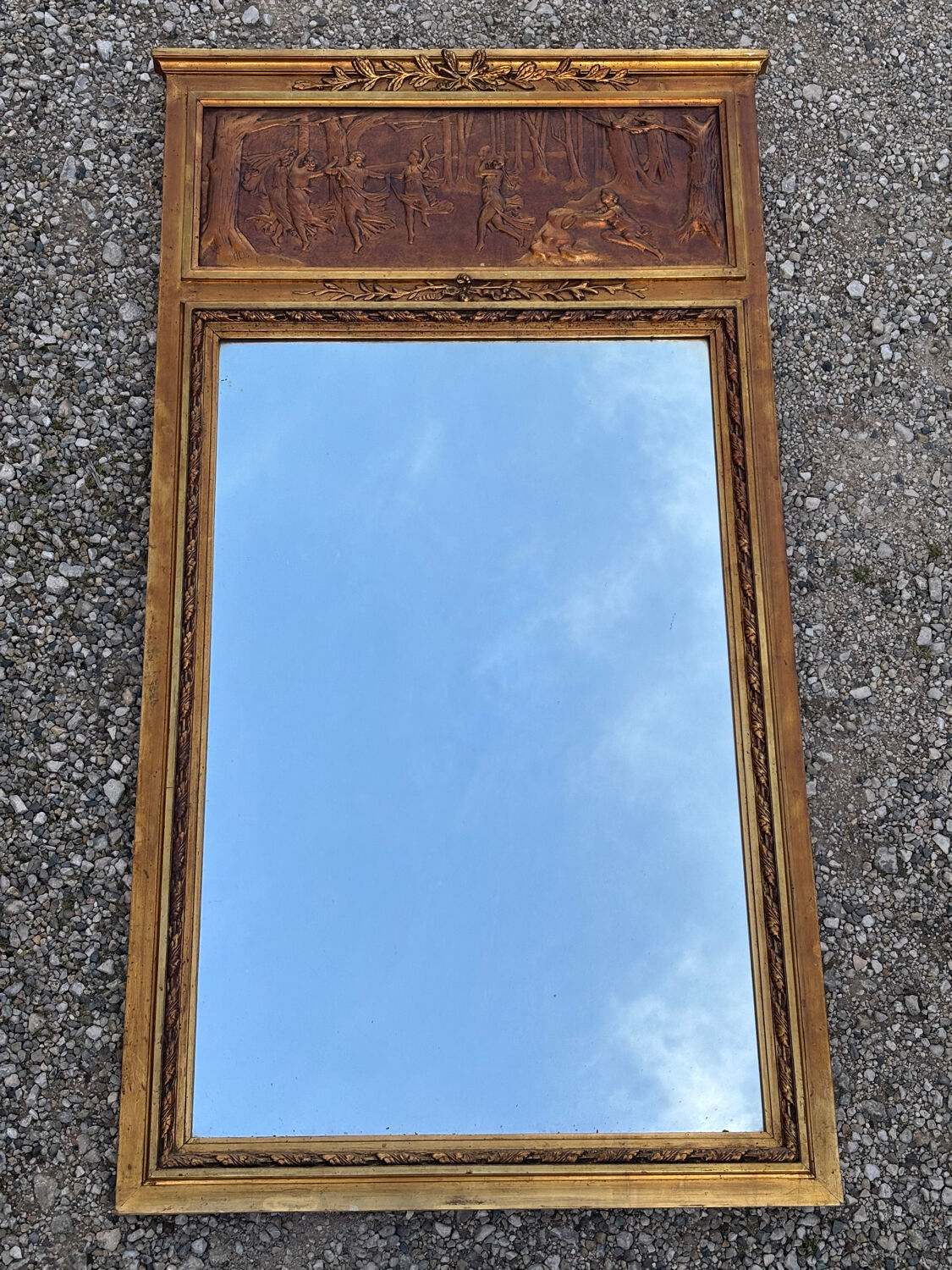 Golden trumeau mirror in Louis XVI style, 20th century.