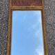 Golden trumeau mirror in Louis XVI style, 20th century.