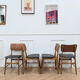 Set of 4 Danish chairs in teak and black faux leather, 1960s.