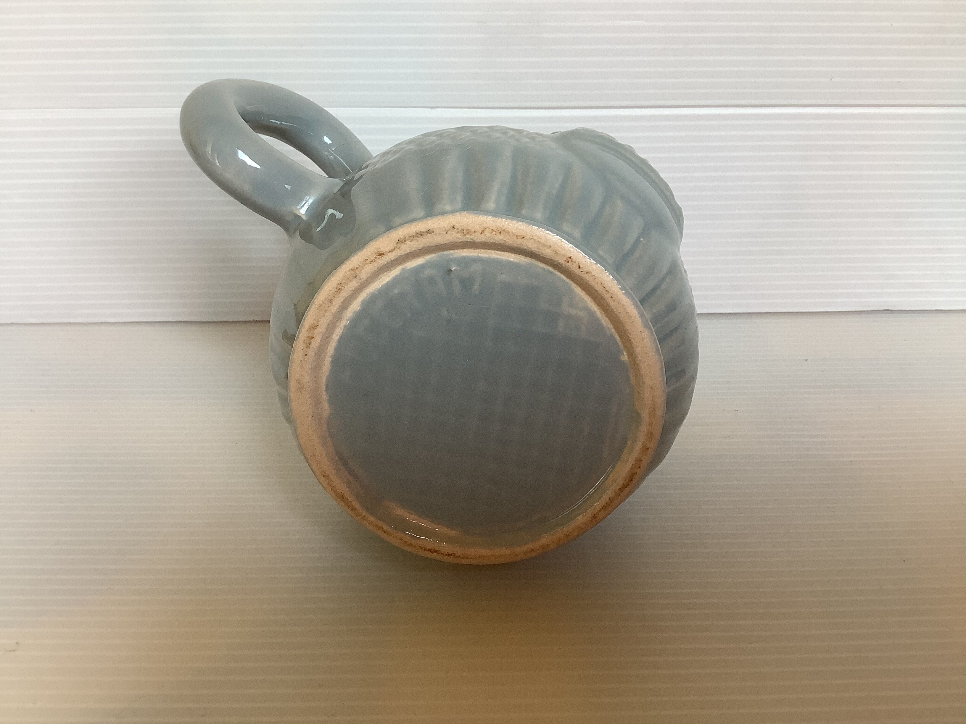 Old grey earthenware Pernod jug