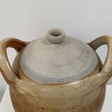 Ancient jar in varnished sandstone