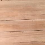 Low farmhouse table in raw wood