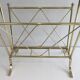 Neoclassical style magazine rack in brass with glass shelf by Maison Jansen