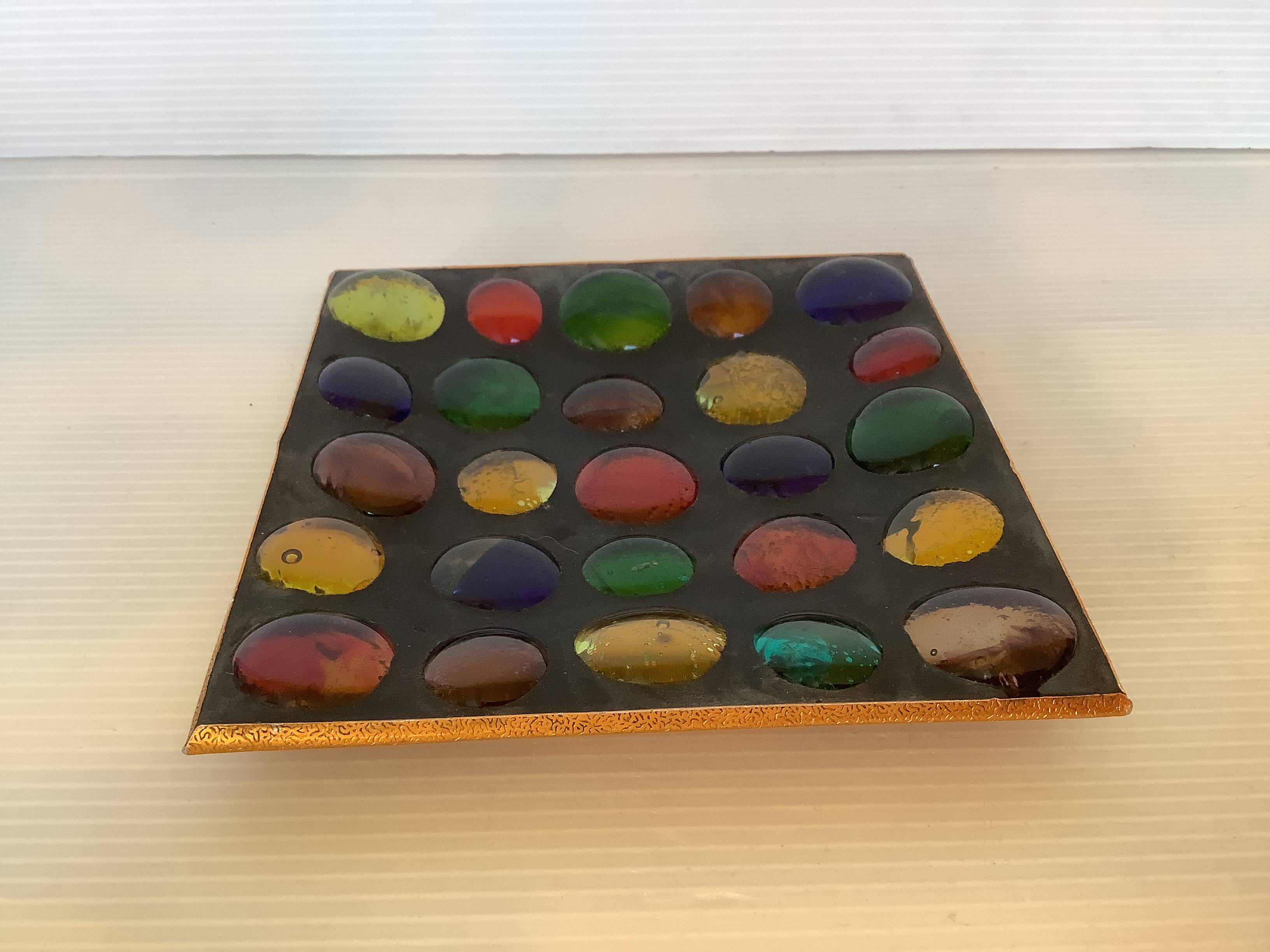 Empty pocket of multicolored glass pellets