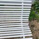 Old garden bench with metal legs and wooden slats