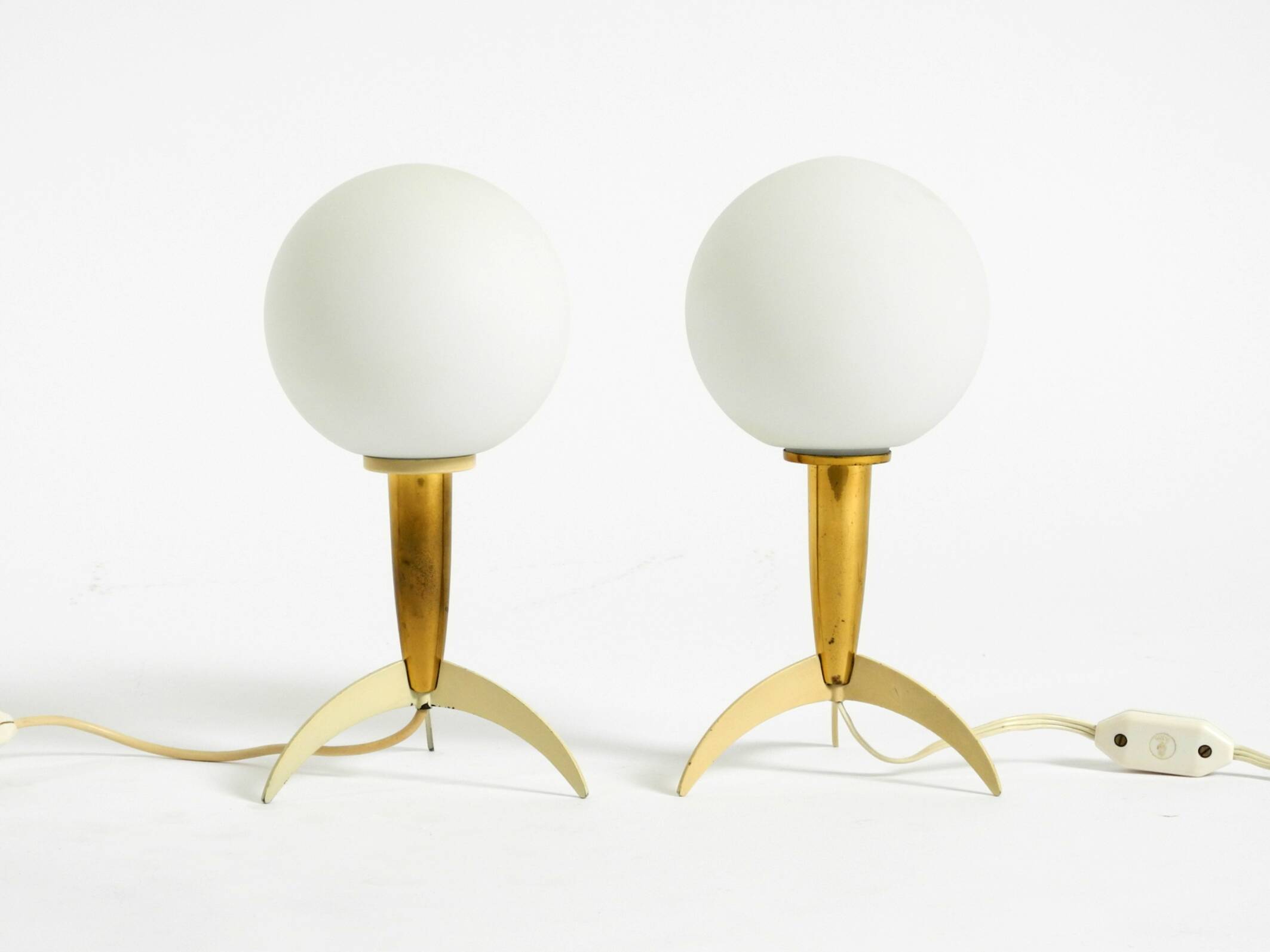 Two Mid-Century Modern rocket table lamps in brass and glass