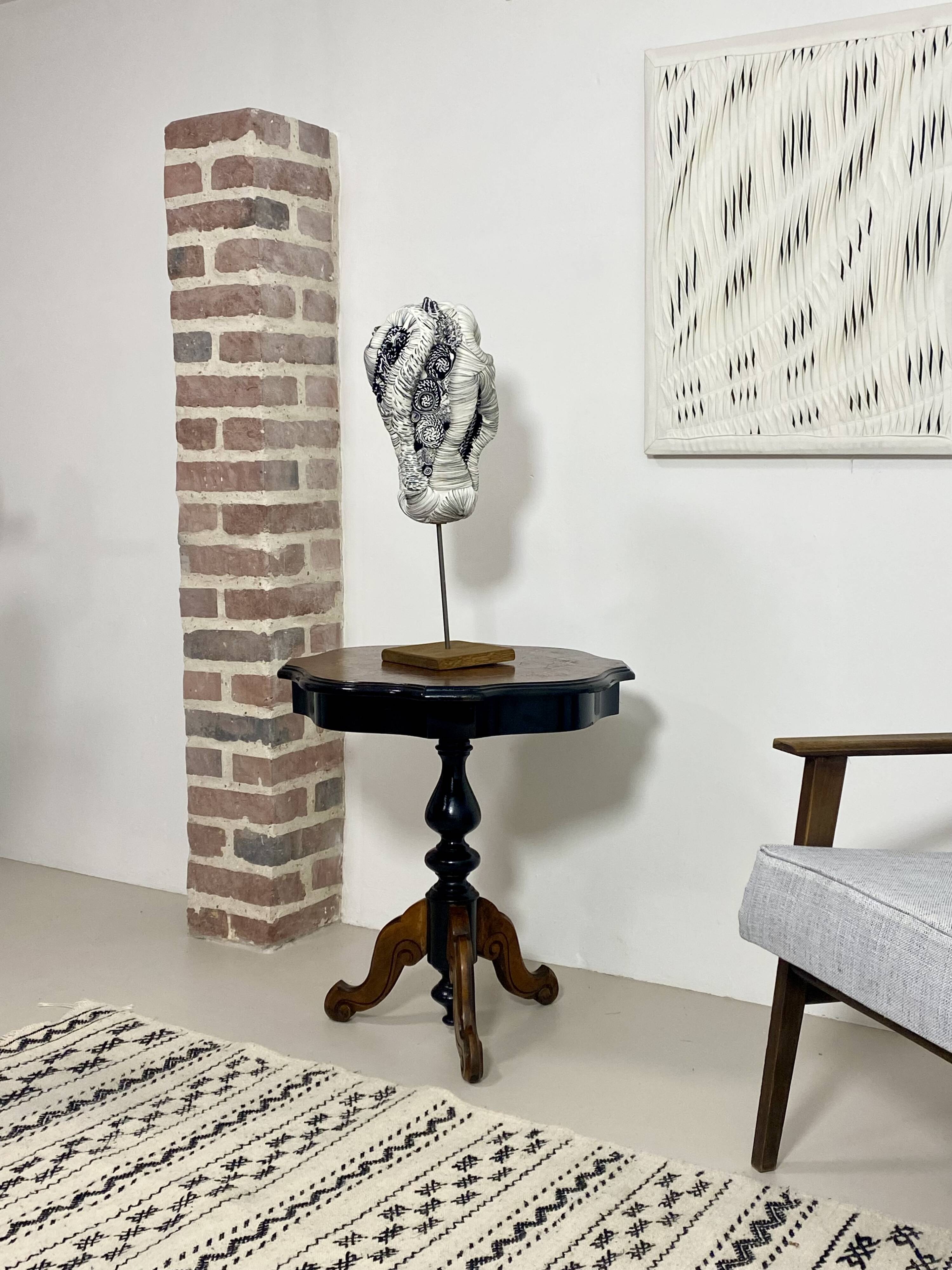 Two-tone black and mahogany pedestal table with mahogany veneer