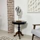 Two-tone black and mahogany pedestal table with mahogany veneer
