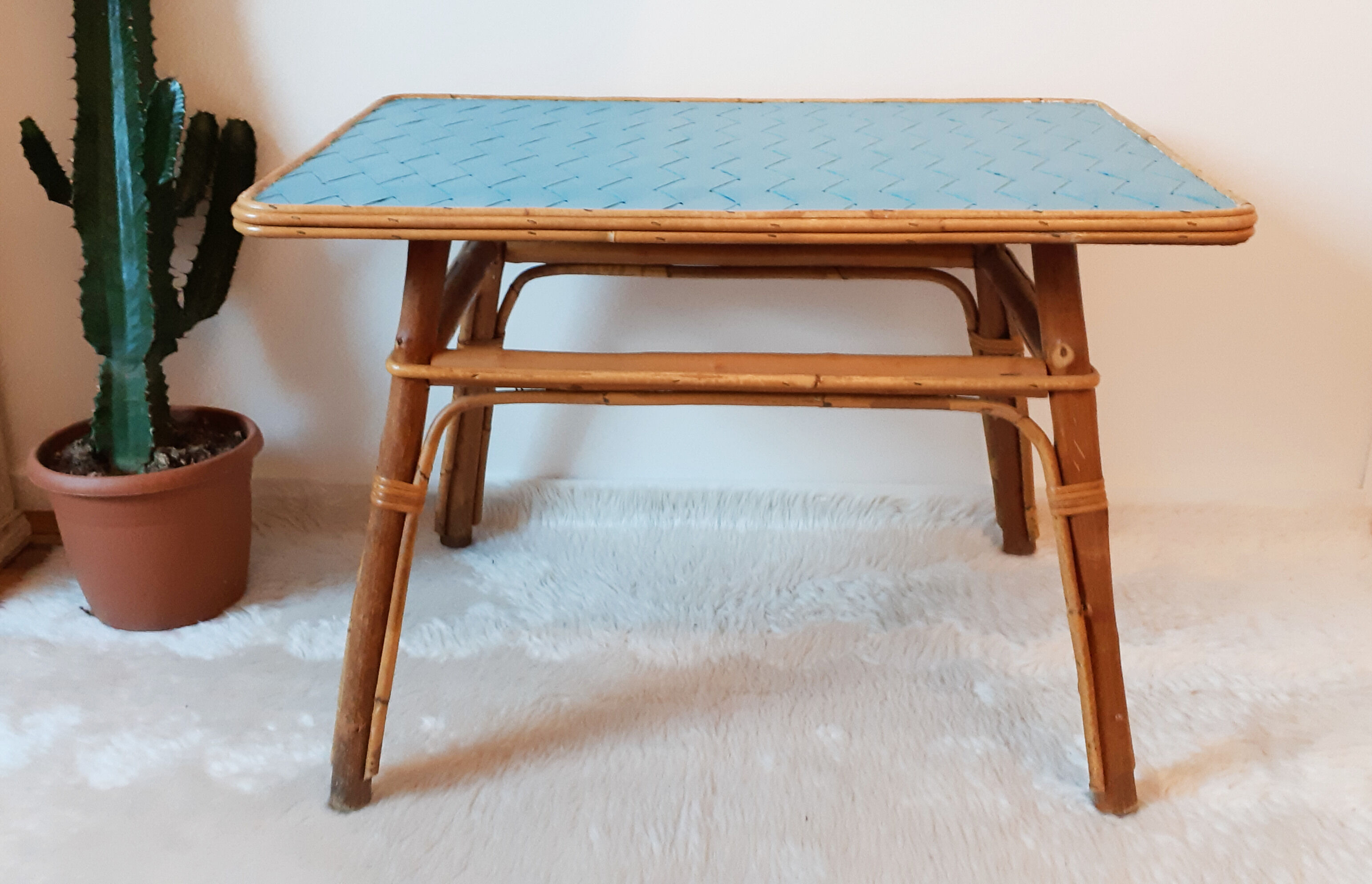Coffee table in blue rattan