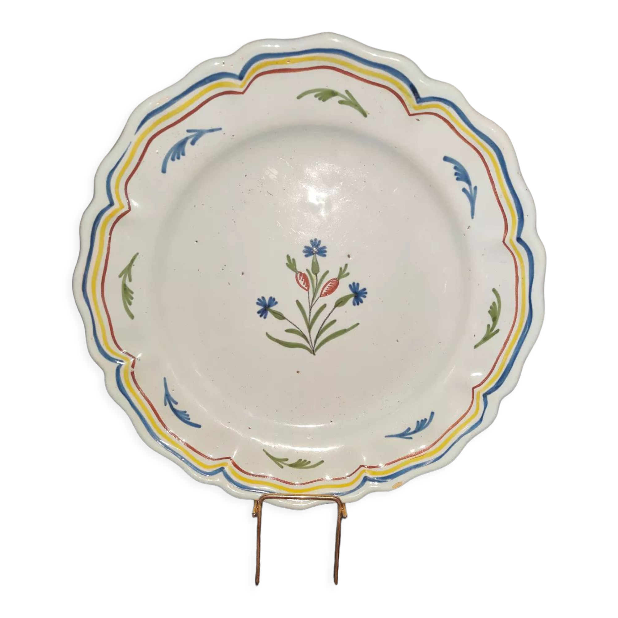 Old plate in earthenware of Nevers eighteenth Century with chantourné edges
