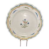 Old plate in earthenware of Nevers eighteenth Century with chantourné edges