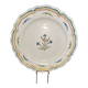 Old plate in earthenware of Nevers eighteenth Century with chantourné edges