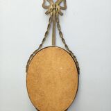 Miroir mural ovale avec cadre en laiton et ruban, Italie