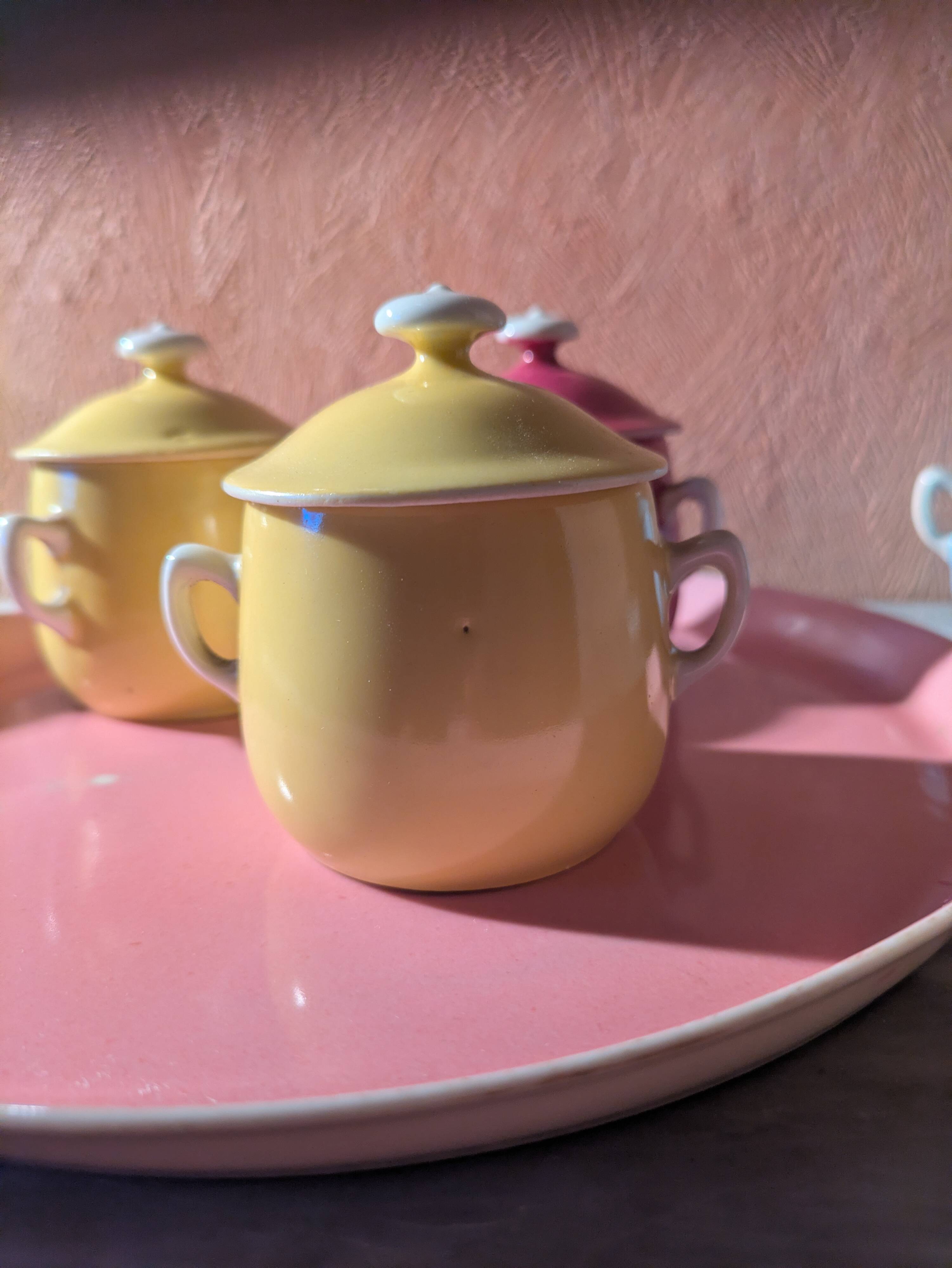 6 small porcelain cream pots from Limoges with a tray.