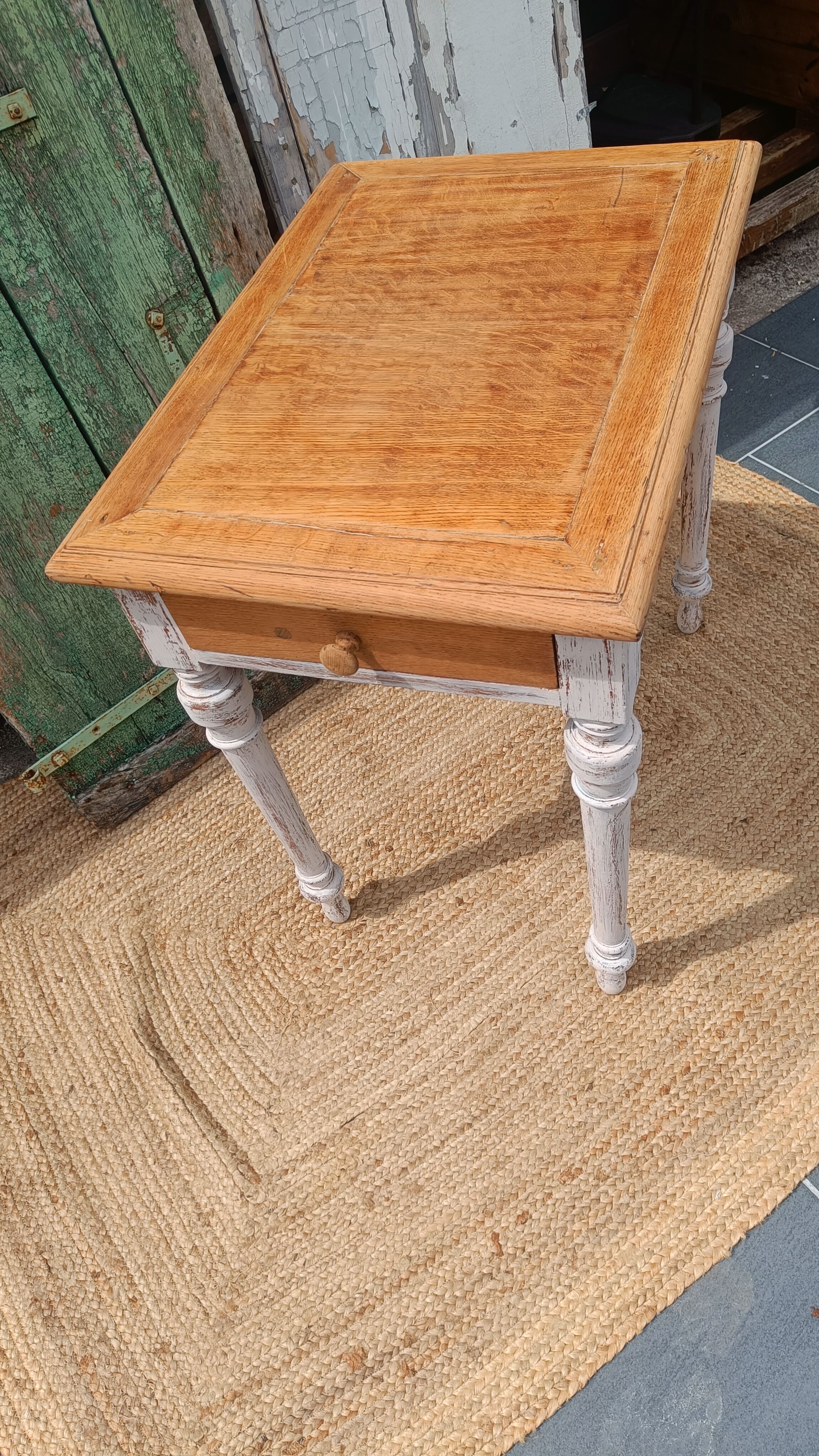 Antique drawer table with a patina.