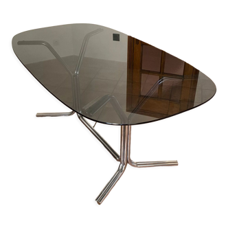 Oval table. 1970. Steel and smoked glass. 180x100
