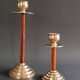 Two vintage wooden and brass candlesticks.