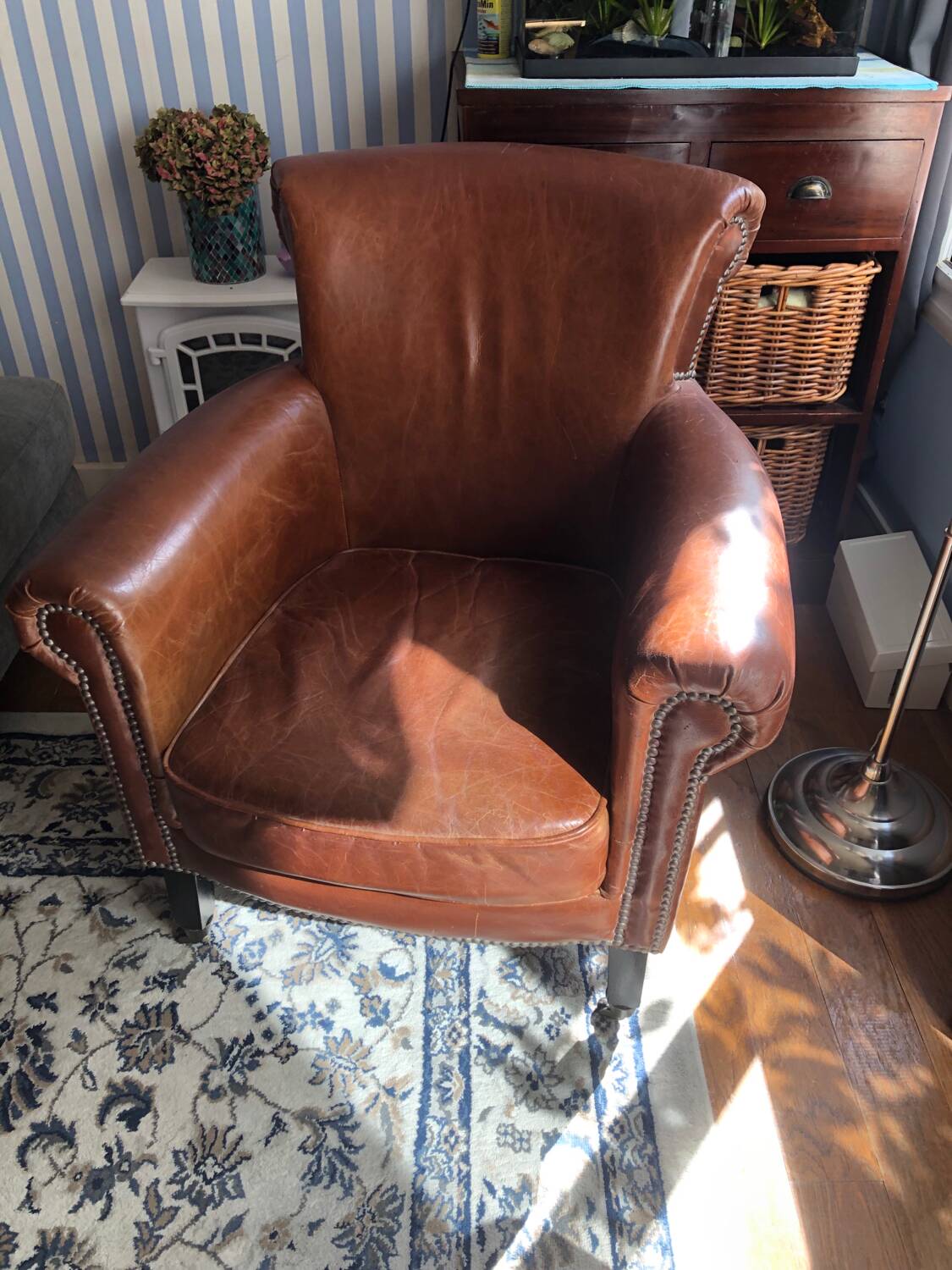 Industrial style aged leather armchair