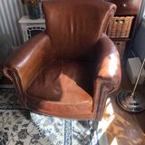 Industrial style aged leather armchair