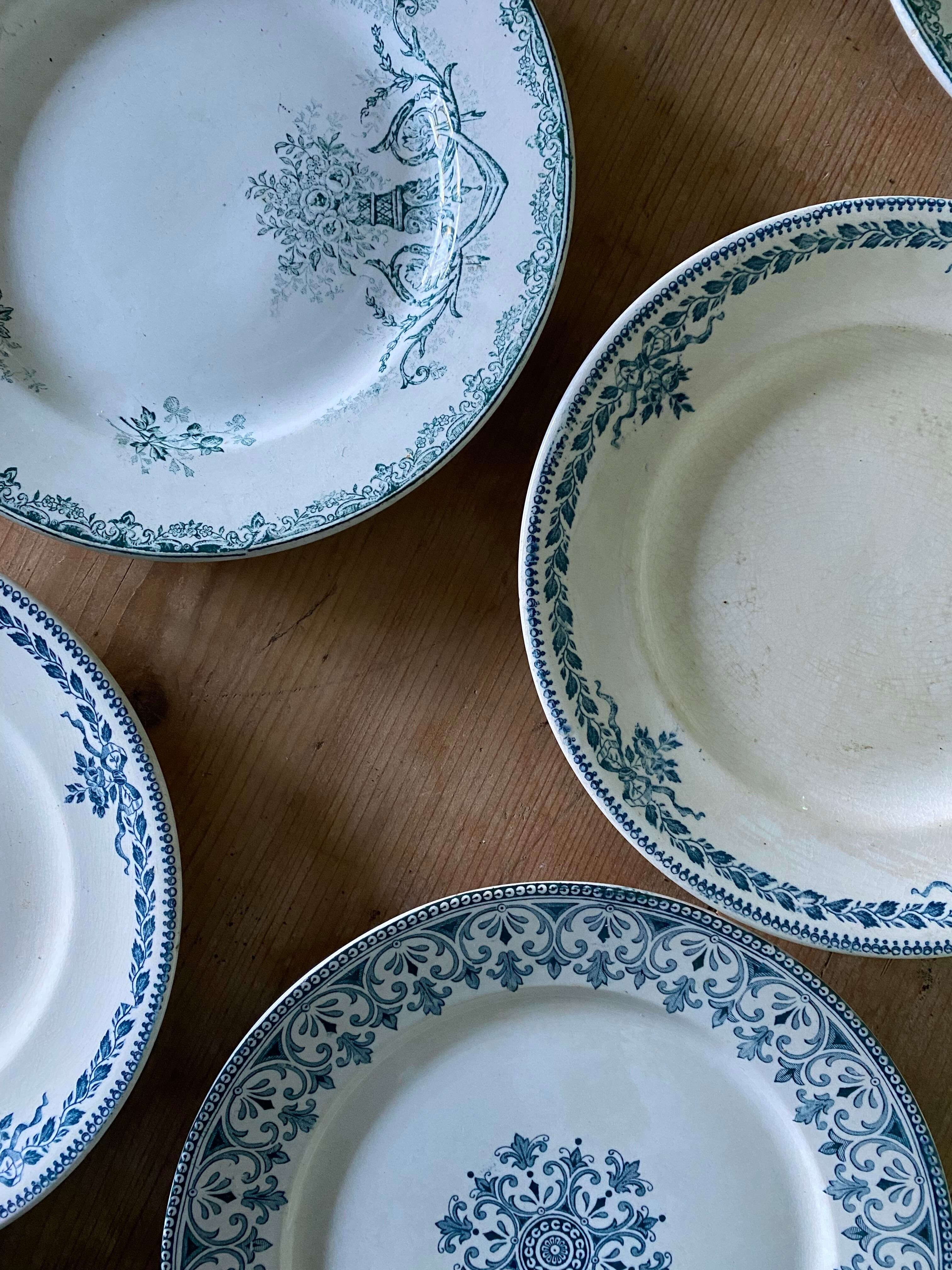 Set of 6 old flat plates in mismatched iron earth