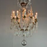 Bronze cage chandelier adorned with molded glass pendants in the shape of peacock feathers, circa 1800