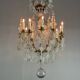 Bronze cage chandelier adorned with molded glass pendants in the shape of peacock feathers, circa 1800