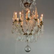 Bronze cage chandelier adorned with molded glass pendants in the shape of peacock feathers, circa 1800