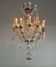 Bronze cage chandelier adorned with molded glass pendants in the shape of peacock feathers, circa 1800
