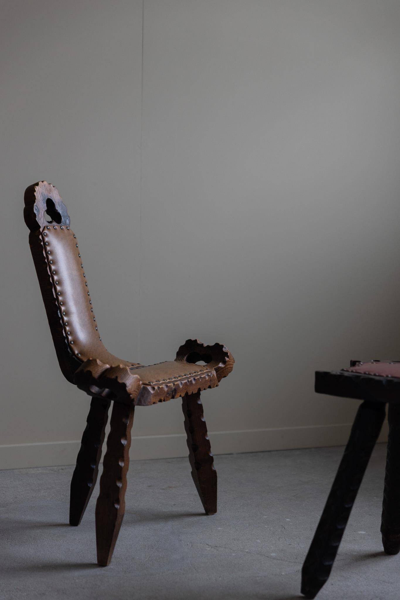 Carved wooden tripod chair with leather seat, Wabi Sabi, early 20th century.