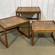 Set of 3 nesting tables in teak with tiled tops.