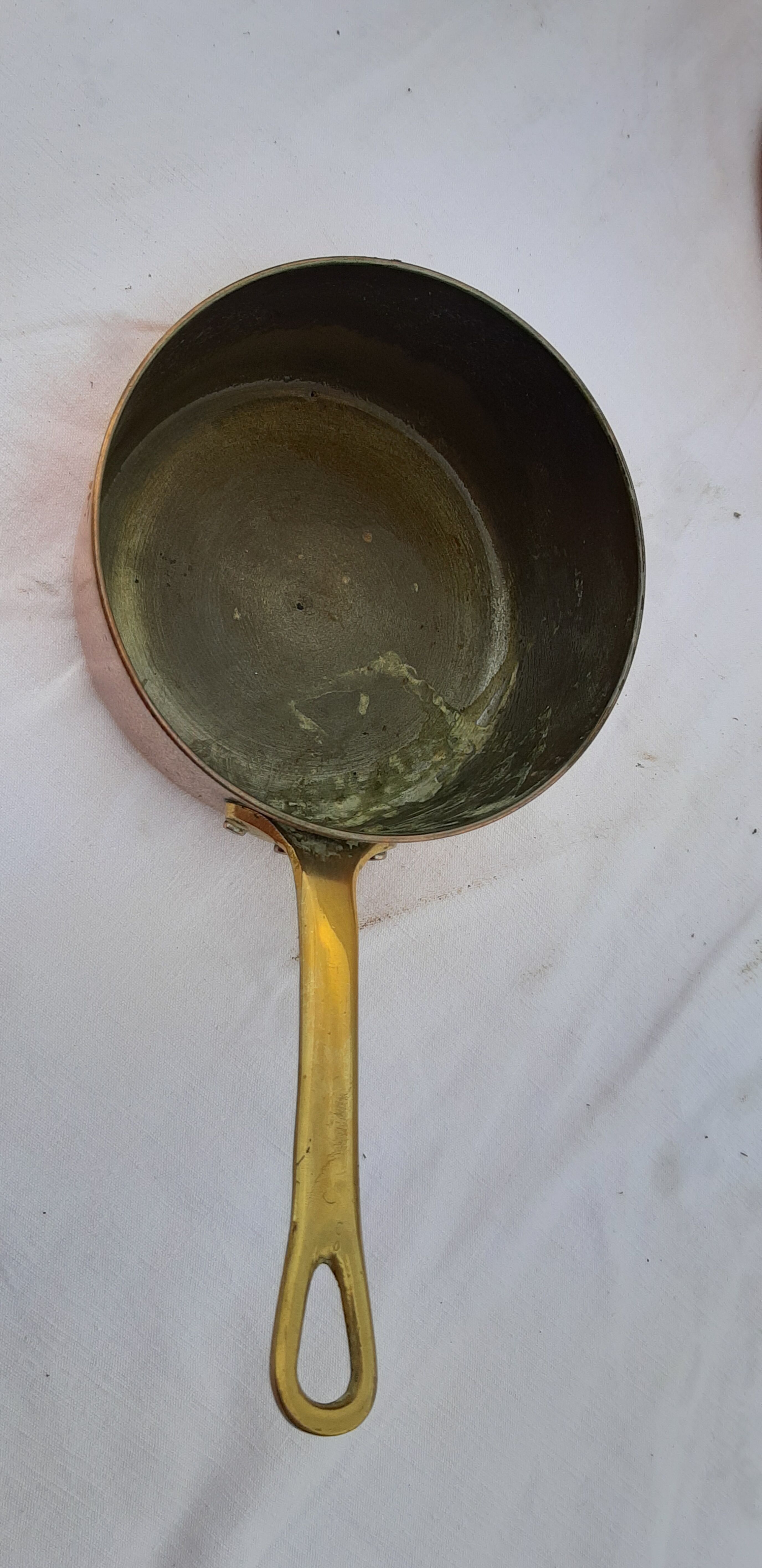 Lots of tinned copper kitchen utensils