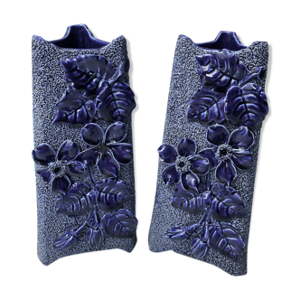 Pair of slip vases with granular blue background decorated with foliage