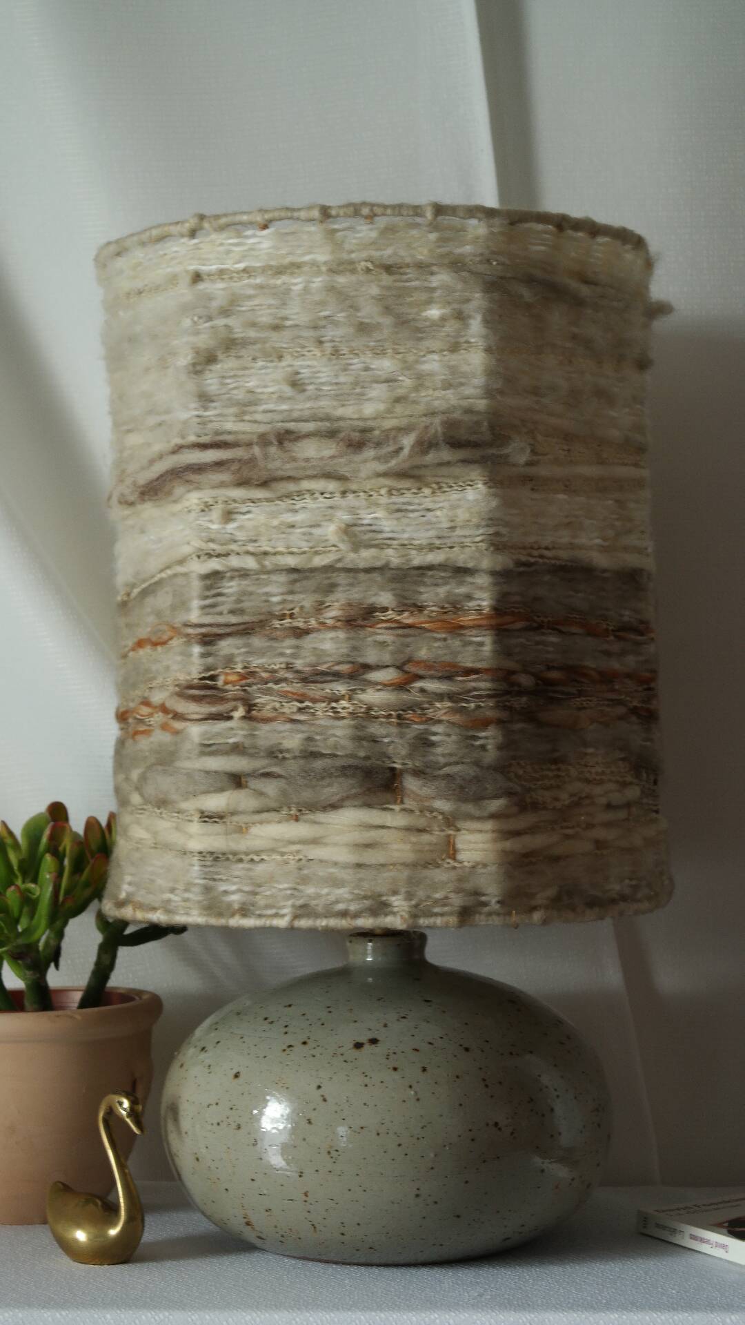 Vintage ceramic lamp with a wool shade.