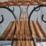 Small antique piece of furniture from the 1960s made of rattan and wrought iron in the shape of a lyre.