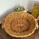 Wicker basket with wooden handles