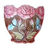 Old pot cover in slurry. pink pattern