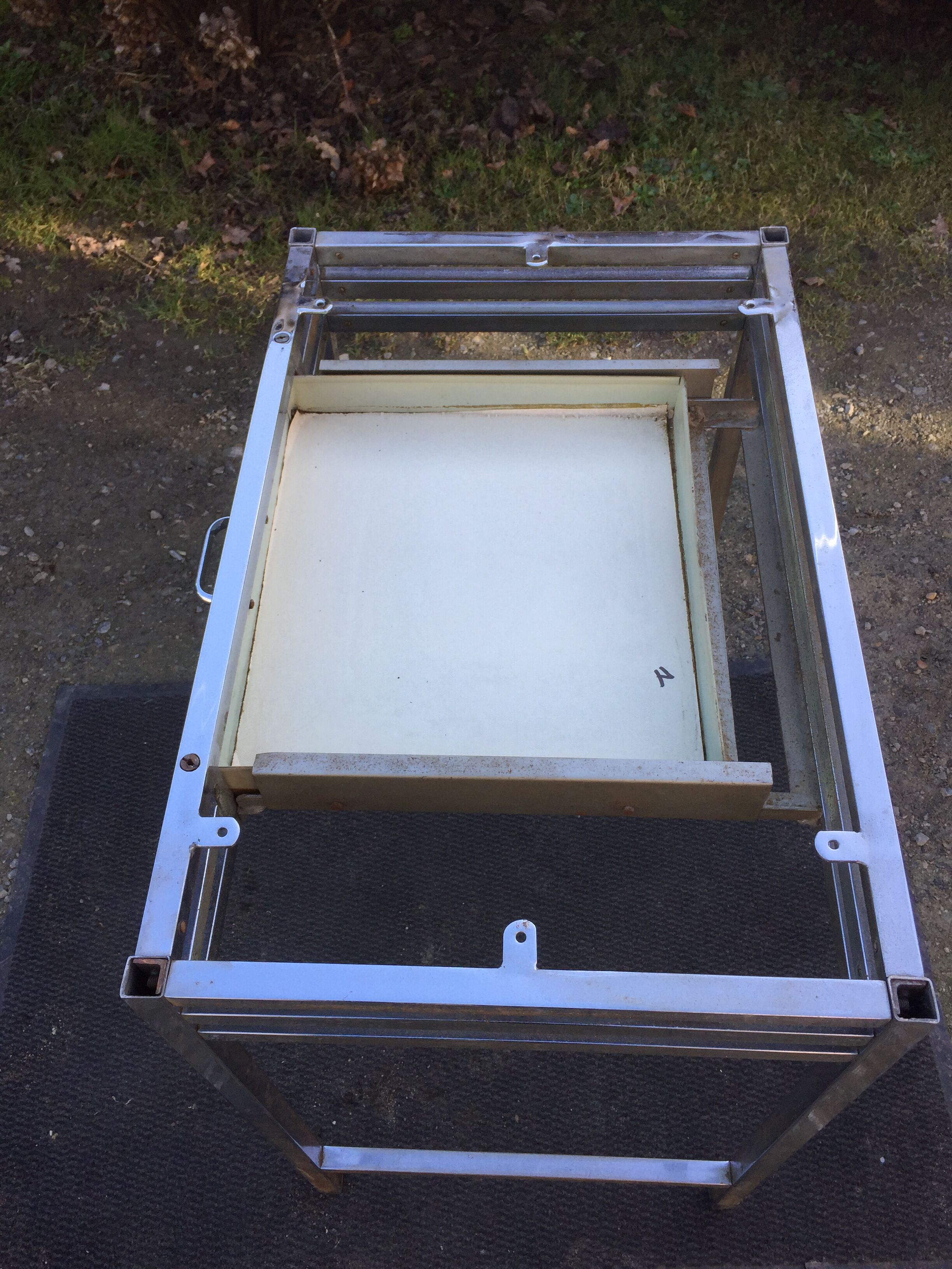 Vintage table with square chrome tubular metal base and marble top.