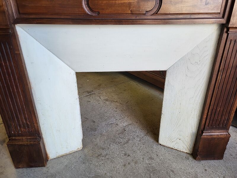 Facade of antique wooden fireplace