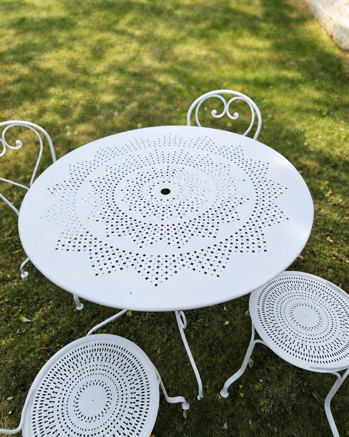 Renovated antique garden furniture in wrought iron, early 20th century.