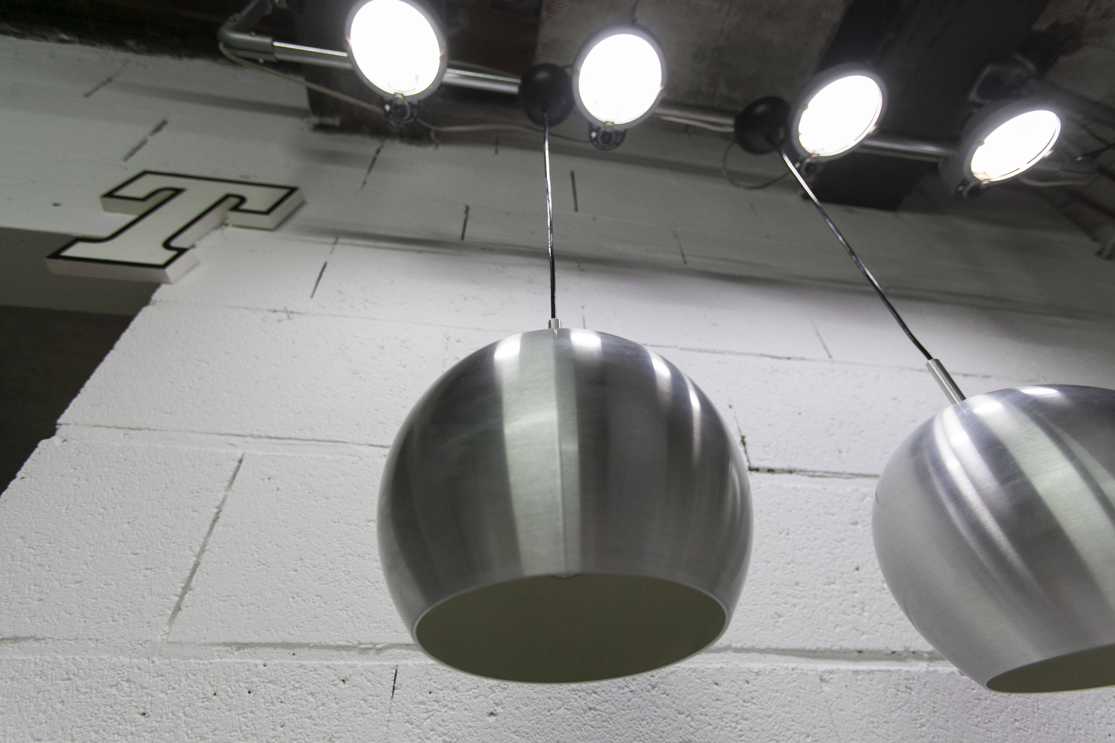 Pair of functional 70's aluminum ball pendants