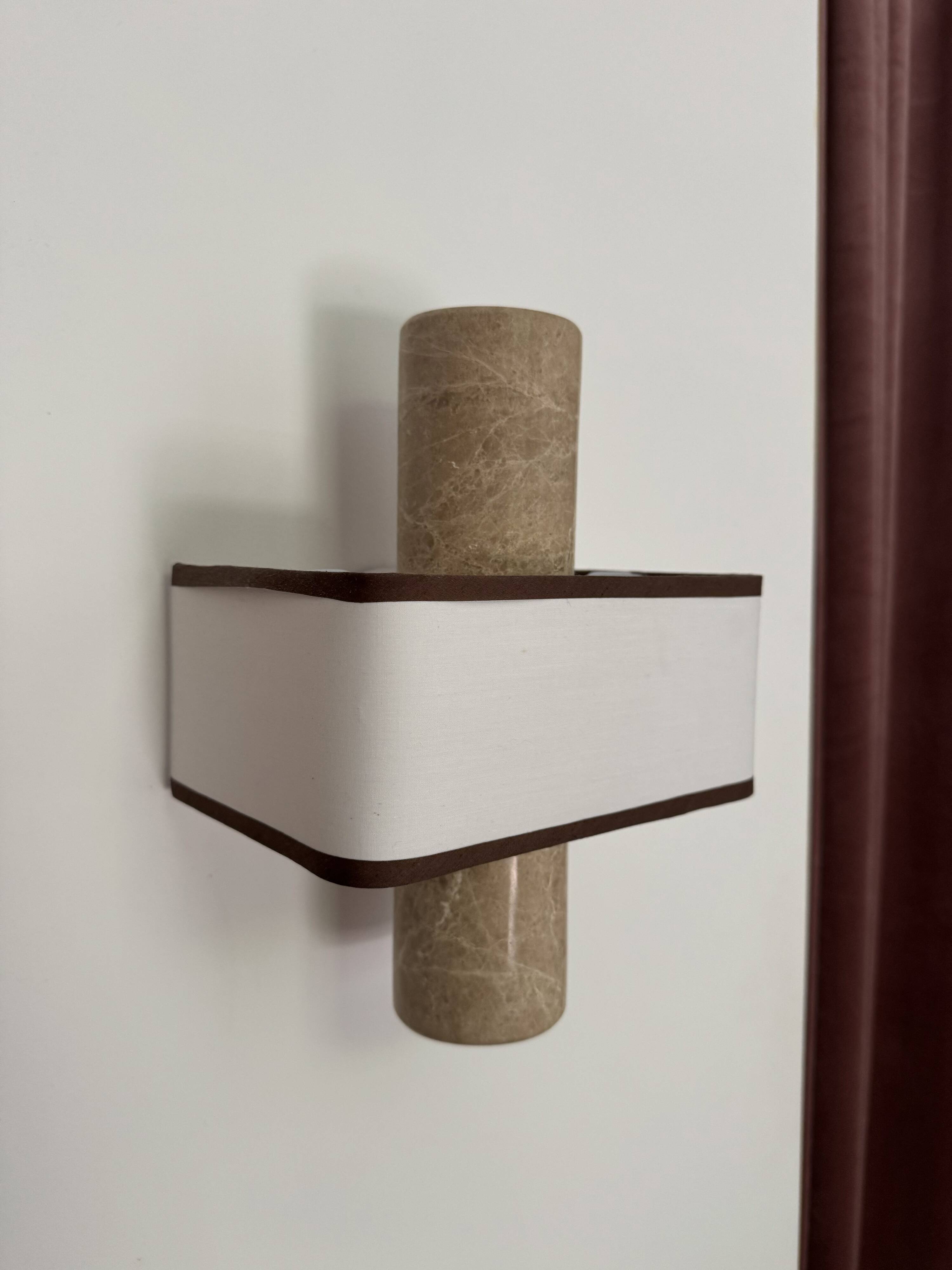 Pair of marble wall lights with fabric shades