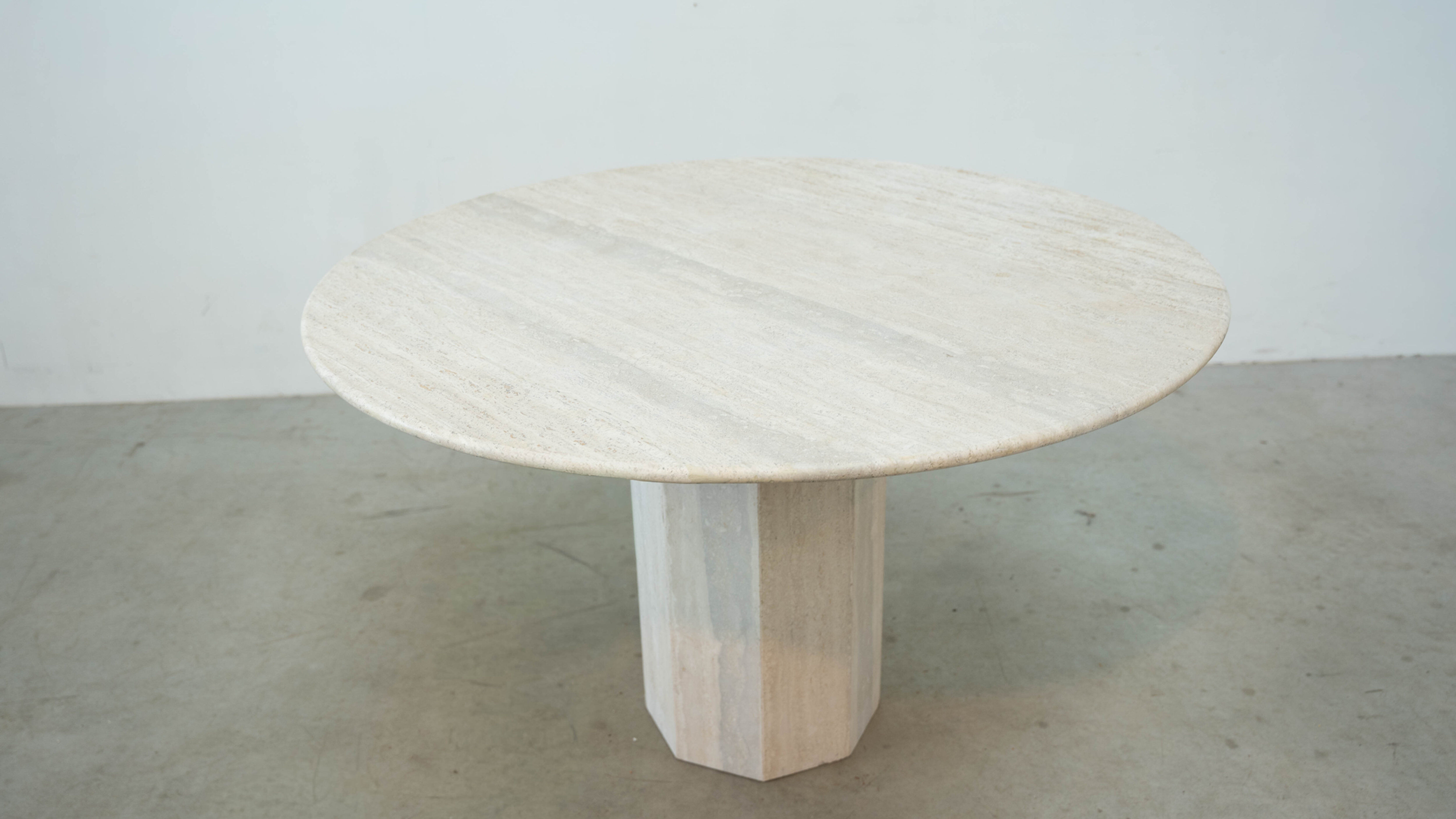 Round Belgian travertine dining table