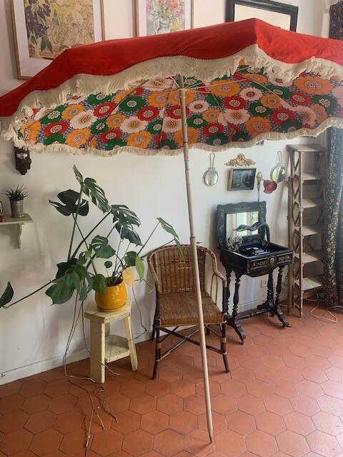 Large floral tilting beach umbrella with cotton fringes, 1960