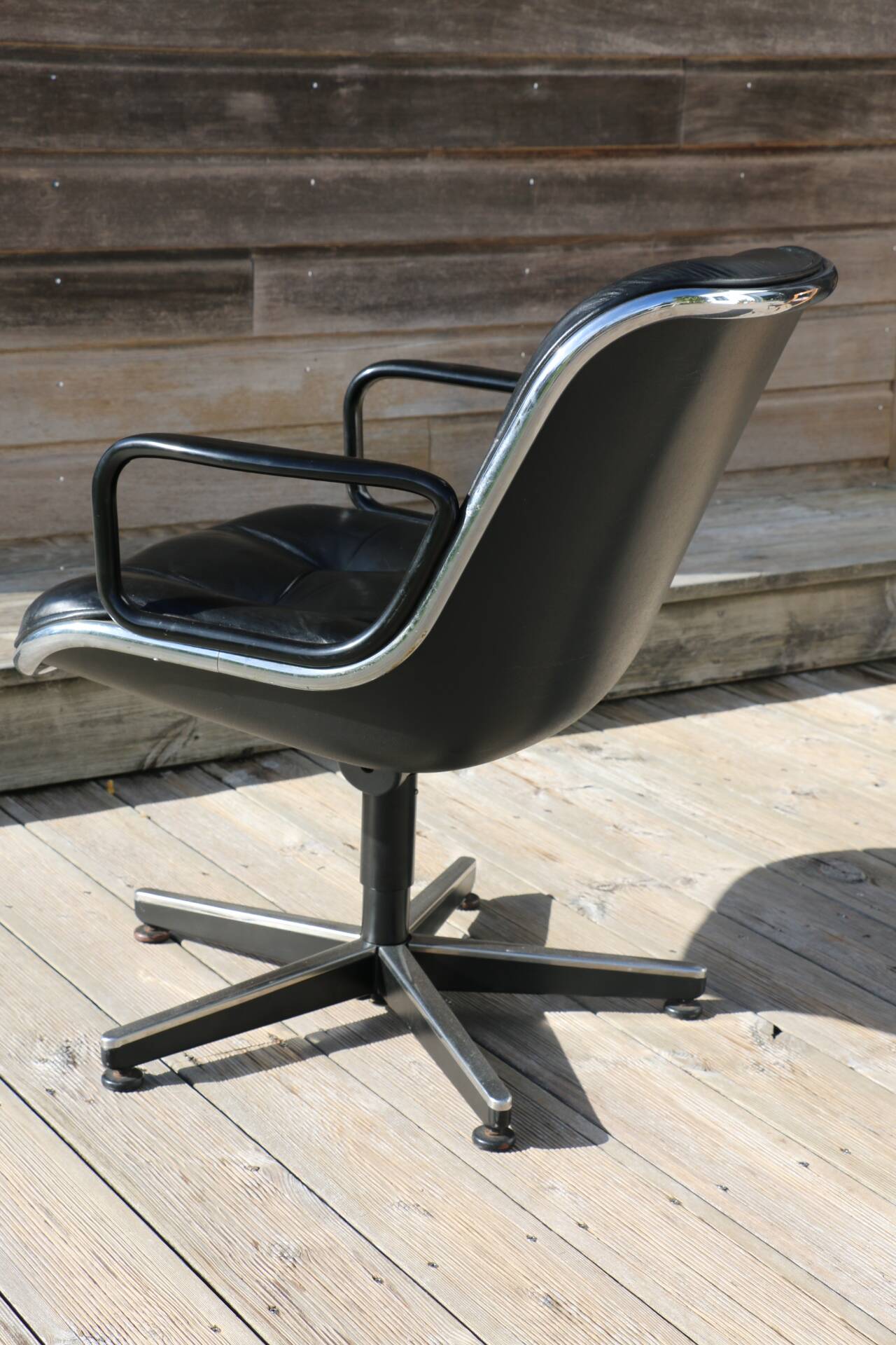 Pollock black leather reclining armchair with fixed ends