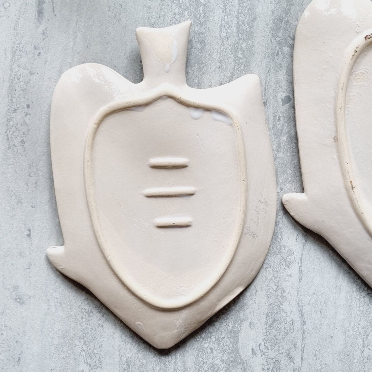 2 empty ceramic fish pockets