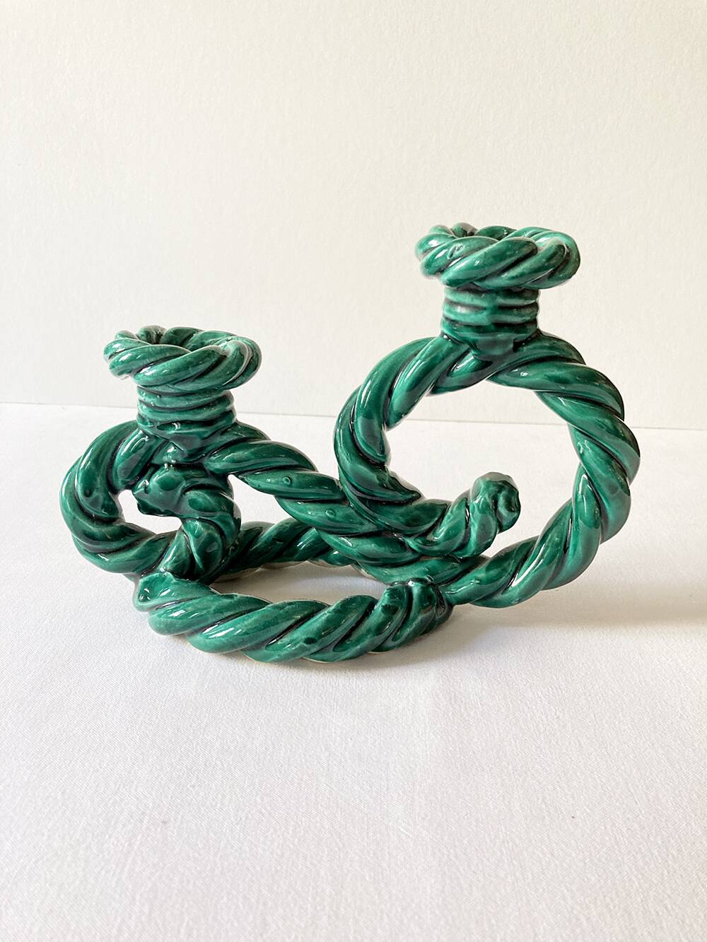 Two-armed candlestick in green glazed ceramic, braided effect