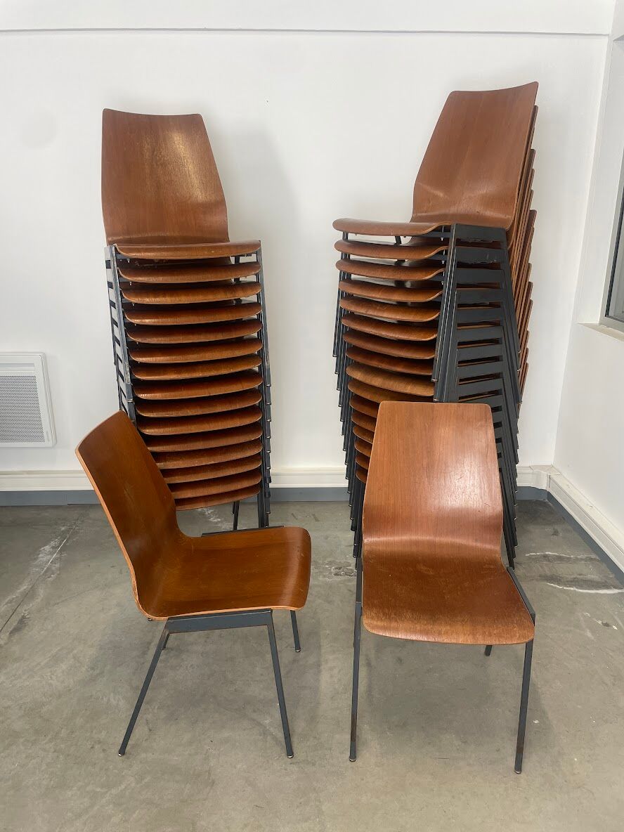 Set of 33 stackable wooden chairs 70s, origin Germany.